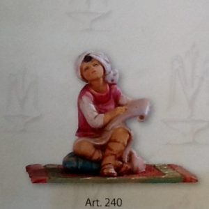 Statuina"bimbo arabo seduto"realizzato in resina colorata e rifinita a mano per presepe da cm 12